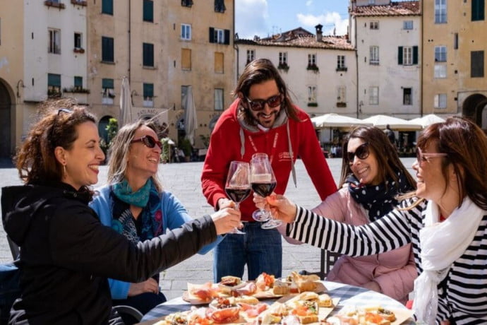 People enjoying an aperitivo and chatting in a bar in Italy